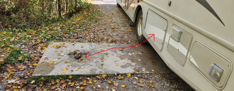 Position your trailer so your drain pipe is within reach of the drain in the ground.